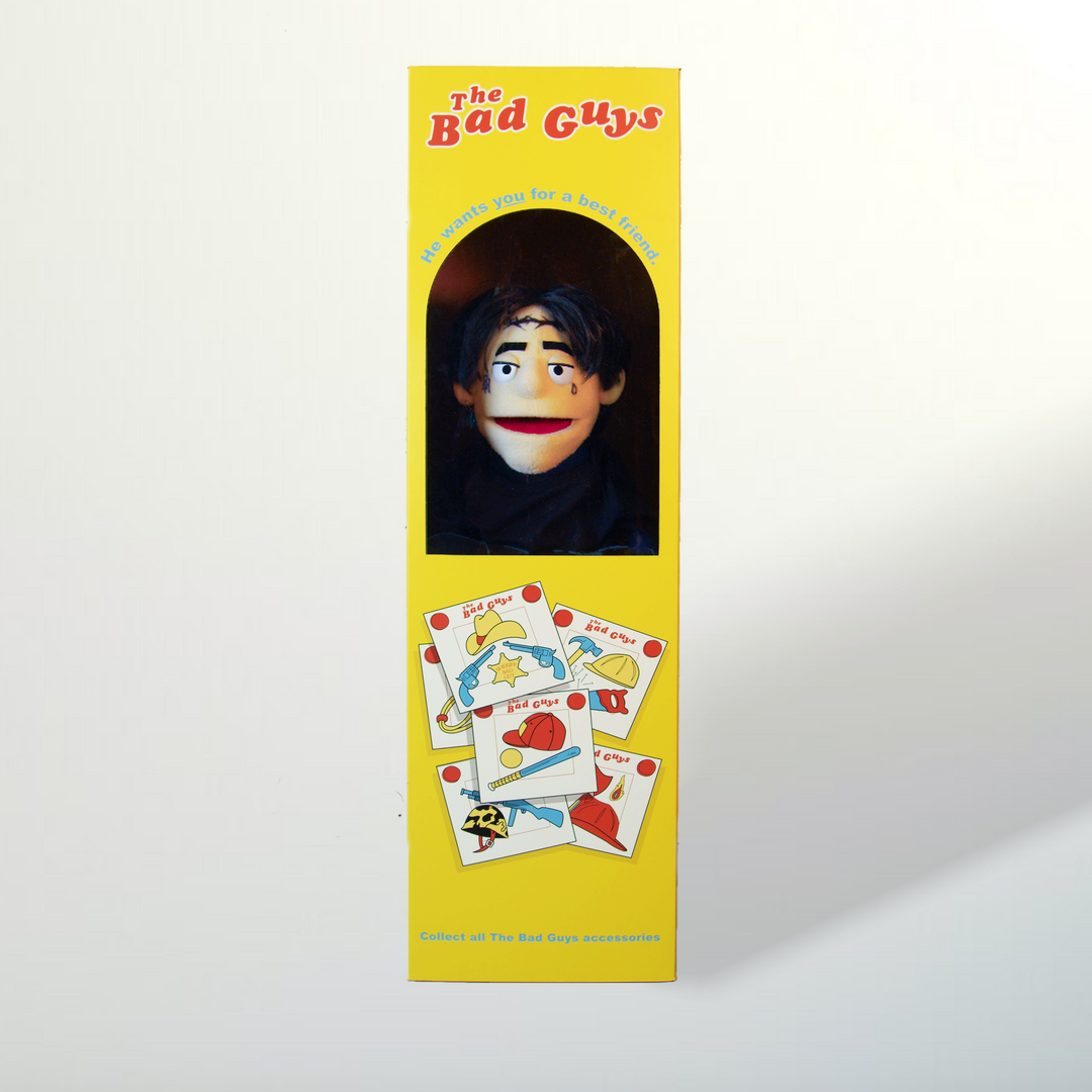 Yellow box packaging for 'The Bad Guys' with a character's face and game cards on a white background